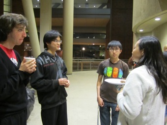 Schuyler, Bob, and Wesley listen intently to what Dr. Pei Yun Lee has to say.