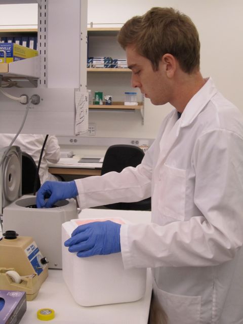 Michael loading DNA tubes in centrifuge.