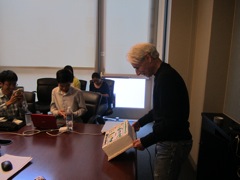 Dr. Goldberg presents a celebratory cake to his students.