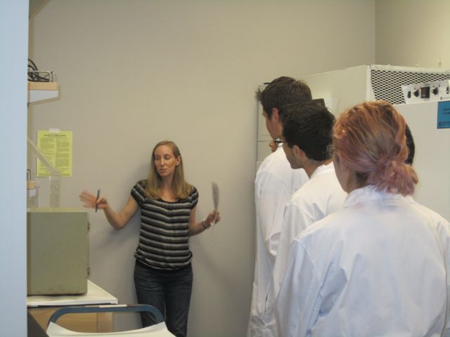 Dr. Henry introduces the students to the lab equipment.