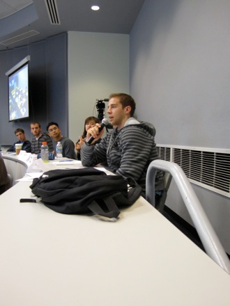 Jonathan asks Dr. Evans questions during her lecture.