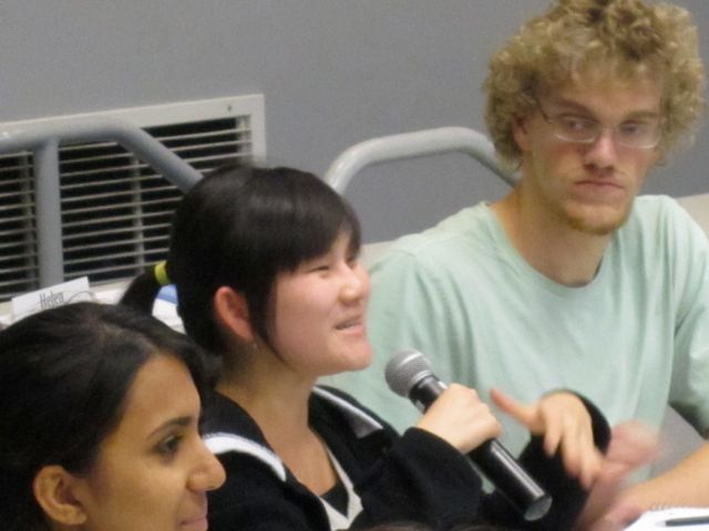 Kim smiles on as she continues Q&A with Dr. Lee.