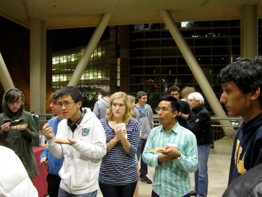 Charlie, Lauren, Argie, and Michael participate in discussion with Dr. Lee at the reception.