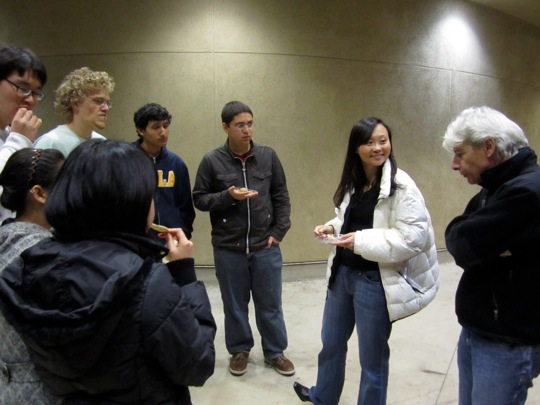 Lecturers wrap up discussion with students at the end of reception.