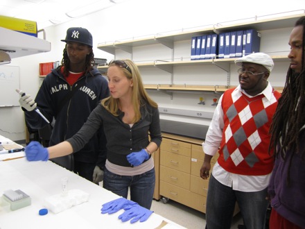 Kelli teaching lab techniques to Tuskegee students.