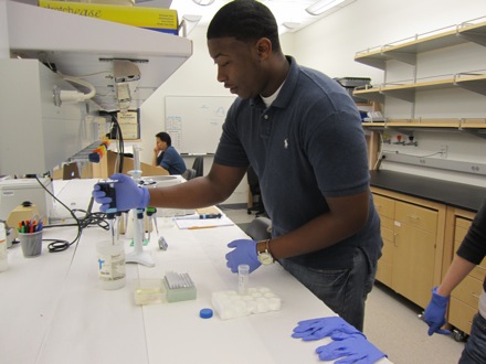 Antonio demonstrates proper lab techniques.