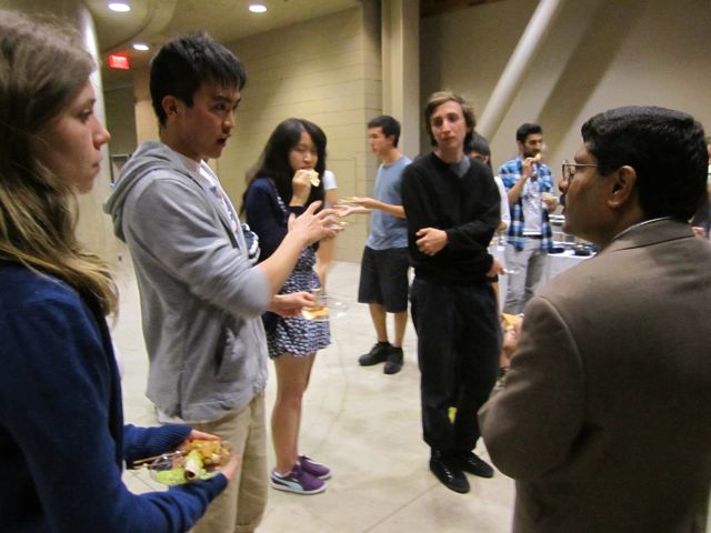 Yuan eagerly asks Dr. Prakash all his questions.