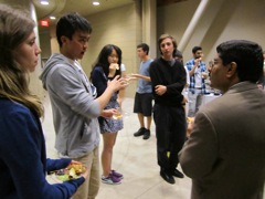 Yuan eagerly asks Dr. Prakash all his questions.