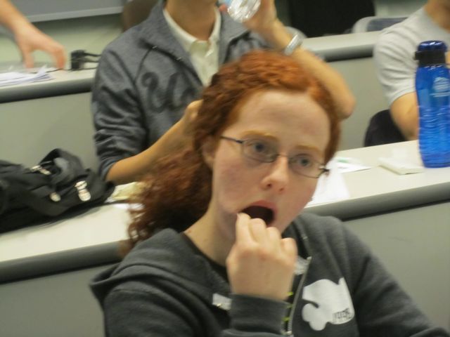 Margo throughly swabs her mouth for a cheek sample.