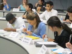 Students write their names on their DNA kit.