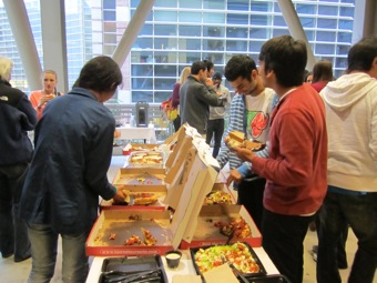 Students gobble up the large BJs catering order for the final reception.