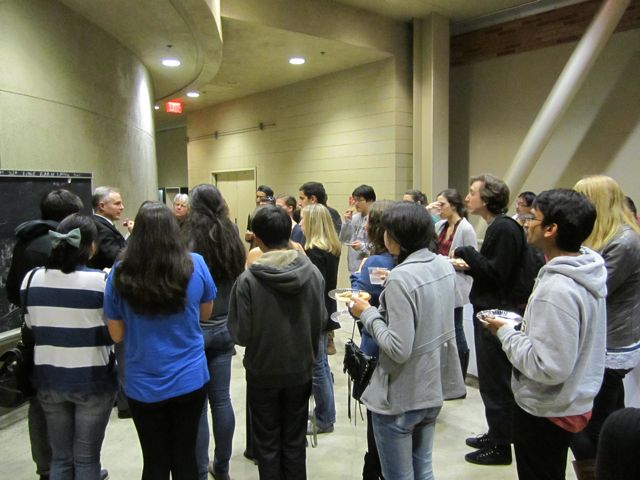 Class surrounds Office Klann to listen to his crime stories.