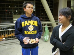 Harrison, Officer Klann's son, converse with teaching fellow Elaine.