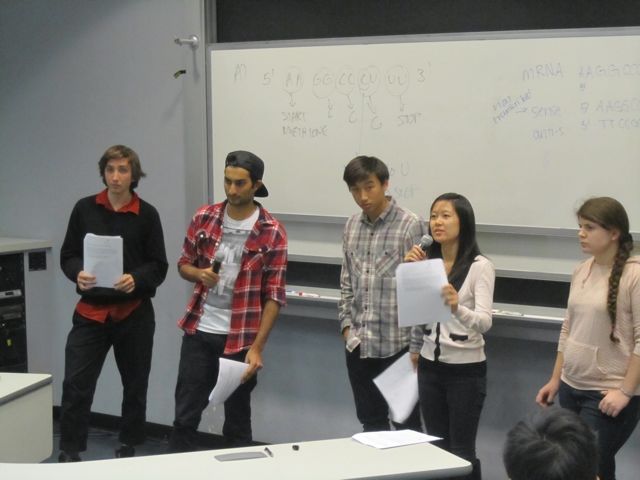 Amelie explains to the class their group's response.