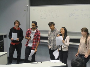 Amelie explains to the class their group's response.