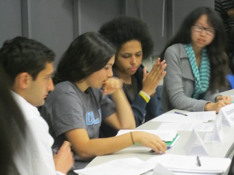 Monica reviews her notes with Brandon from UC Davis.