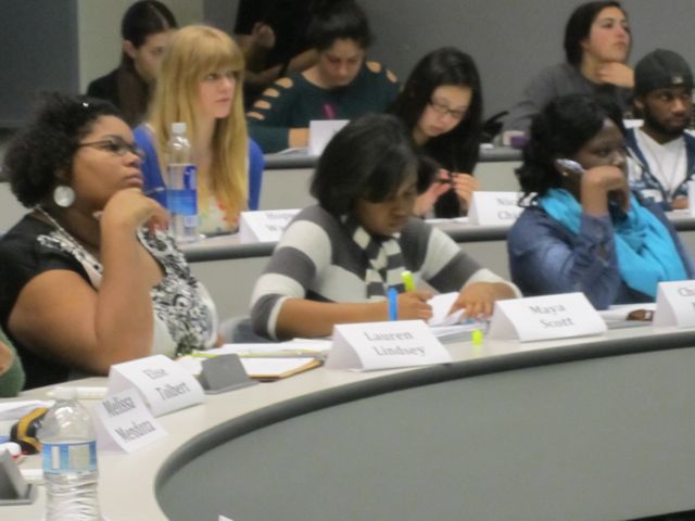 Lauren, Maya, and Chaunte are engaged with the lecture.