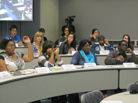 Lauren raises her hand to ask Dr. Harada a question.