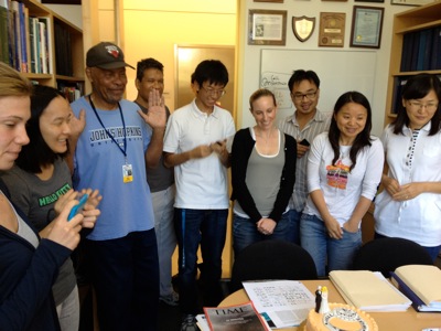 Lab members surprise Dr. G with bday cake