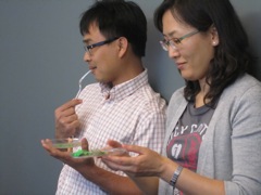 Brandon and Jung-Im having cake in class.