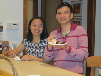 Xiaomeng and Jer-Young savor their slice of cake.